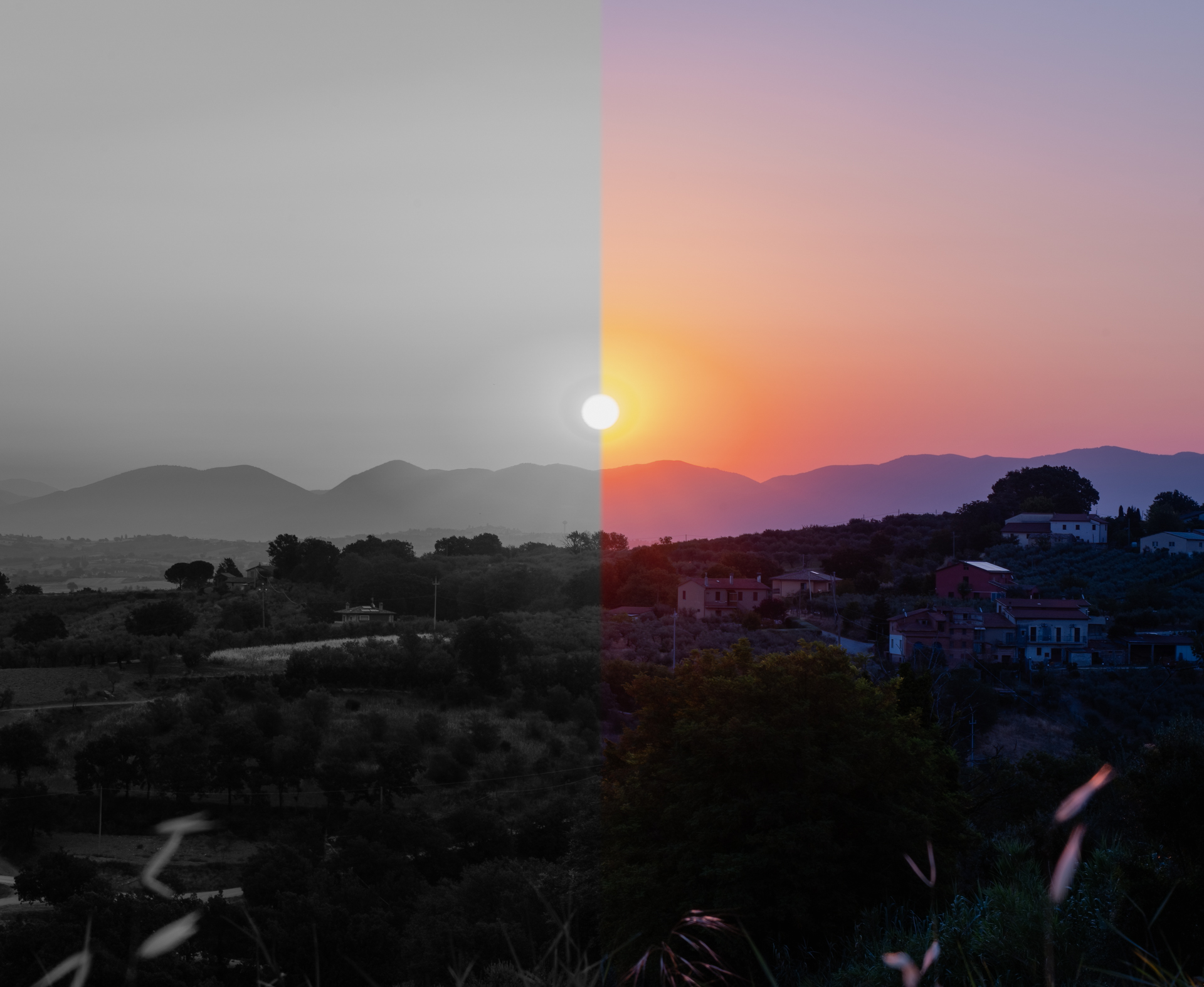 Vuoria ja niiden takana nousevaa aurinkoa esittävä maisemakuva on jaettu mustavalkoiseen ja värilliseen osaan