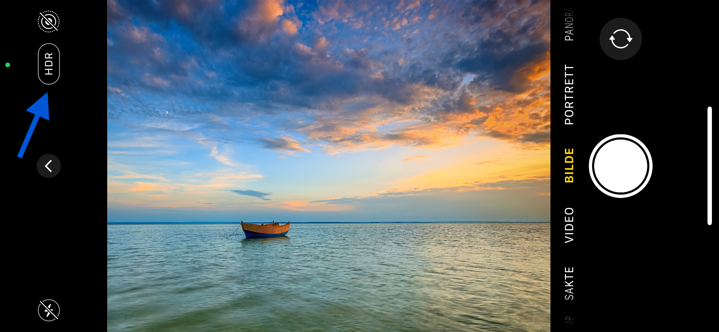 Iphone-kamera viser bilder av hav med båt