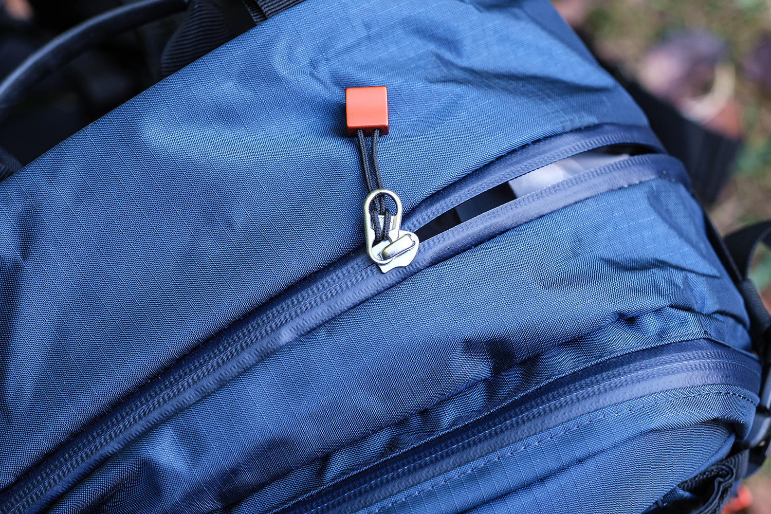 Glidelås på fotoryggsekk.