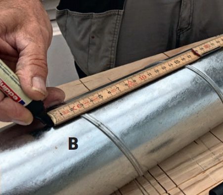 Marker målet på røret til varmeflyttingsanlegg