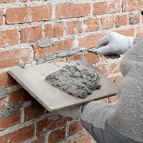 Tiiliseinän rappaus: Saumat täytetään tuo-reella laastilla
