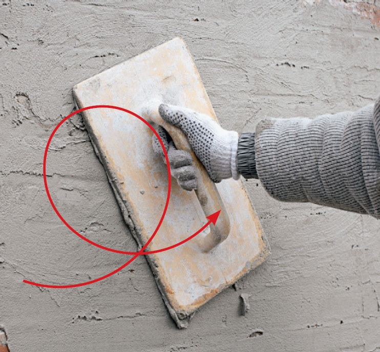 Tiiliseinän rappaus: Laasti työstetään hiertimellä hyvin tiiliseinän pintaan