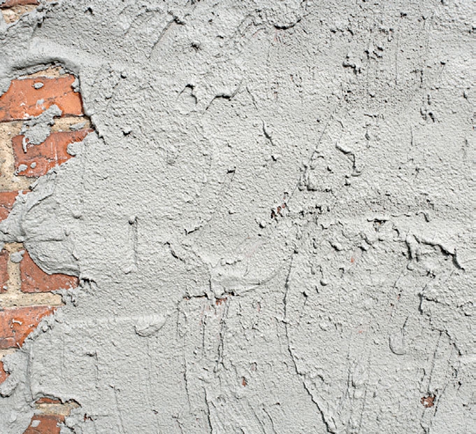 Tiiliseinän rappaus: Laastia heitetään seinään, kunnes se peittyy kokonaan