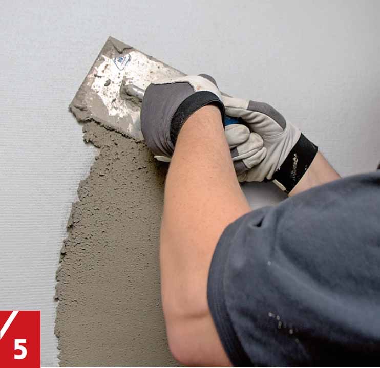 Rappauslaastin levittäminen lasikuitutapetin päälle