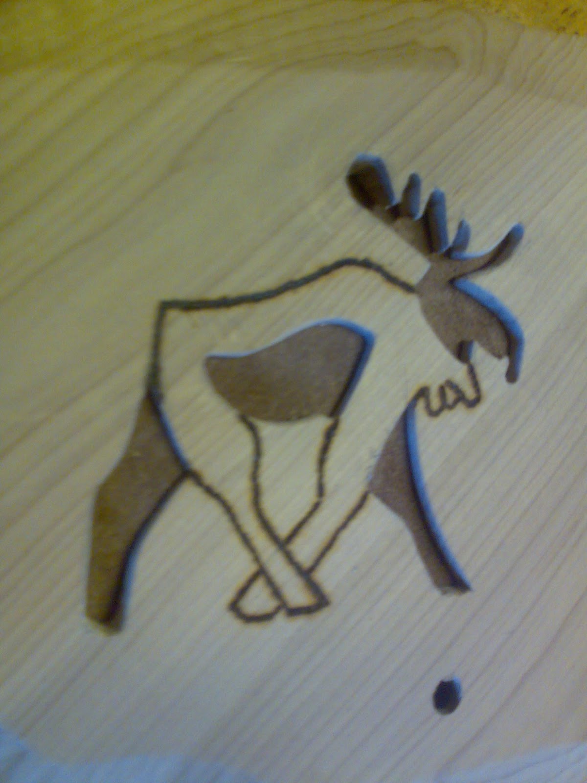 Firestrenget guitar med elgsdyr