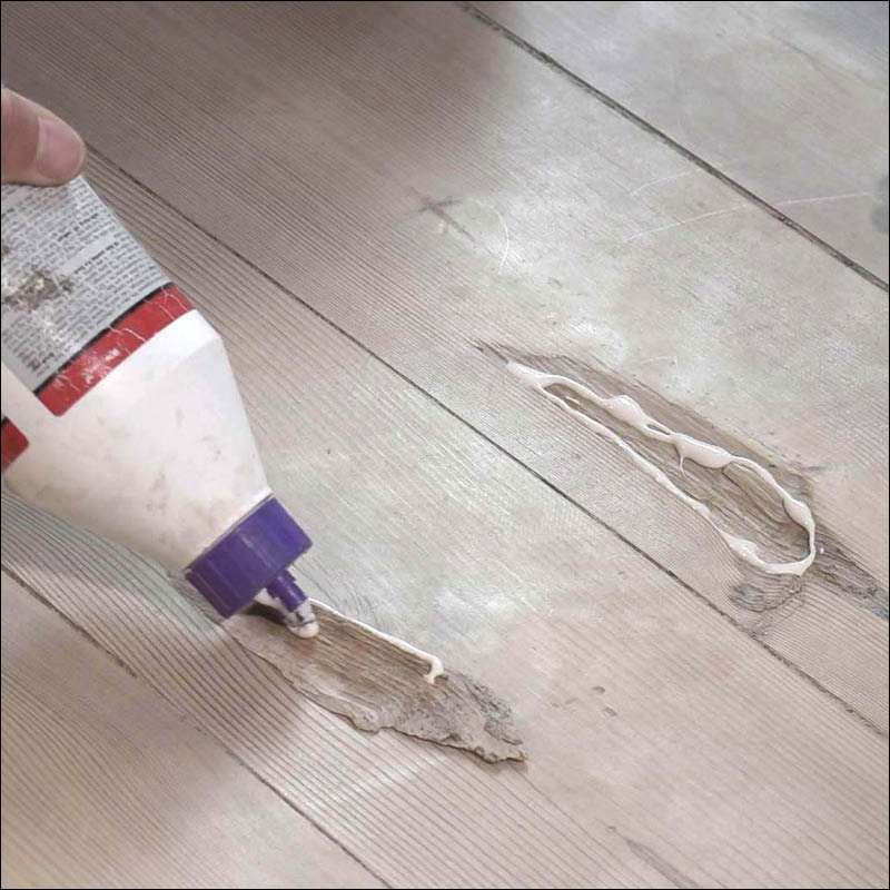 Lattialaudasta irronnut lastu: Levitä puuliimaa koloon ja lastun taakse