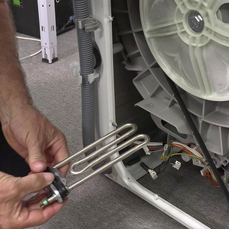 Värmeelement tvättmaskin: Dra ut det defekta värmeelementet