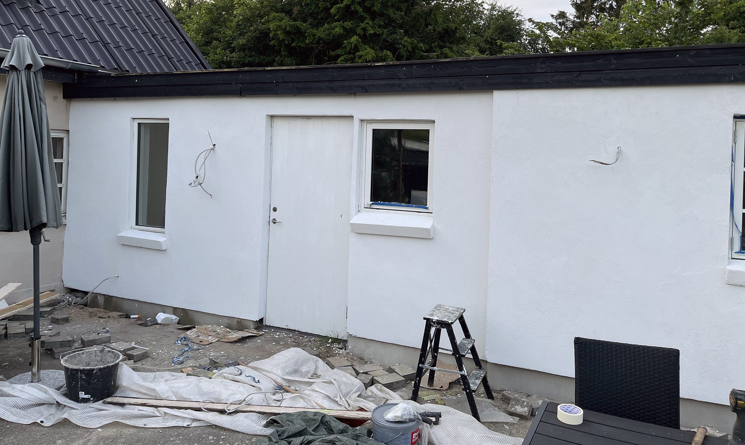 Fra træbeklædning til pudset facade