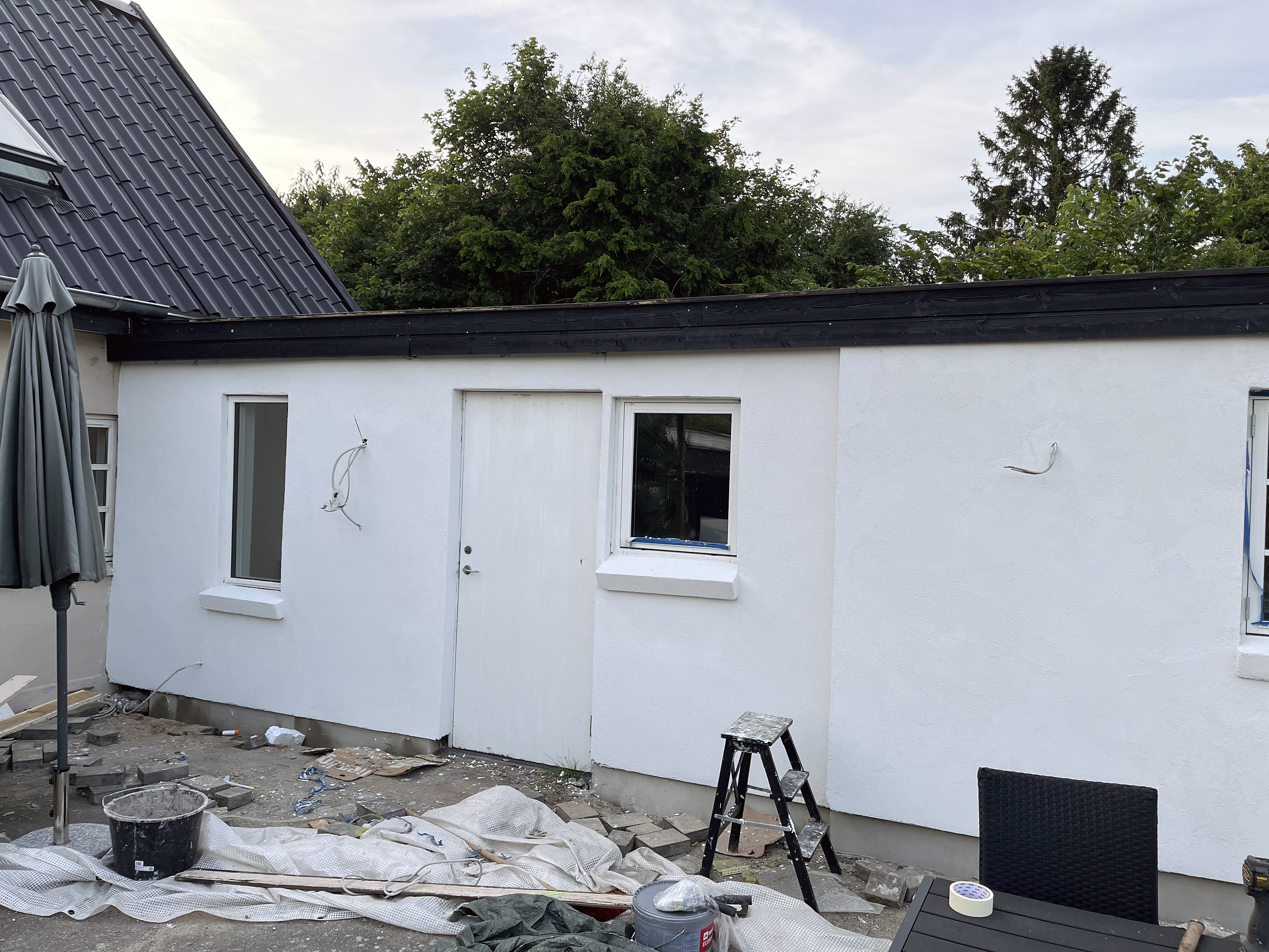 Fra træbeklædning til pudset facade