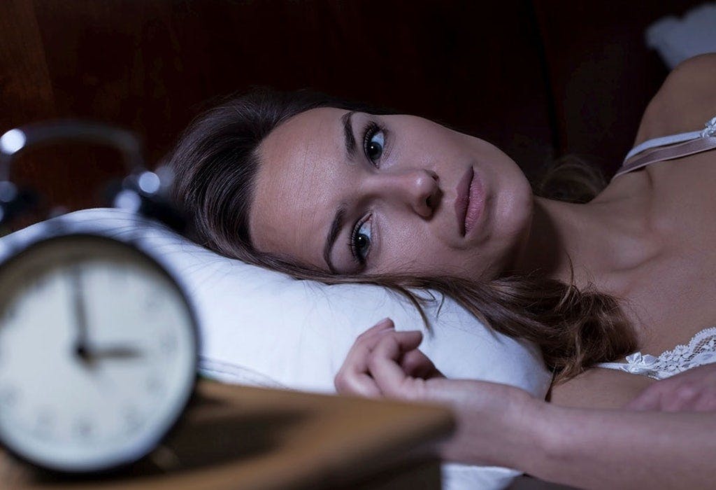Kvinde har søvnproblemer efter kaffe