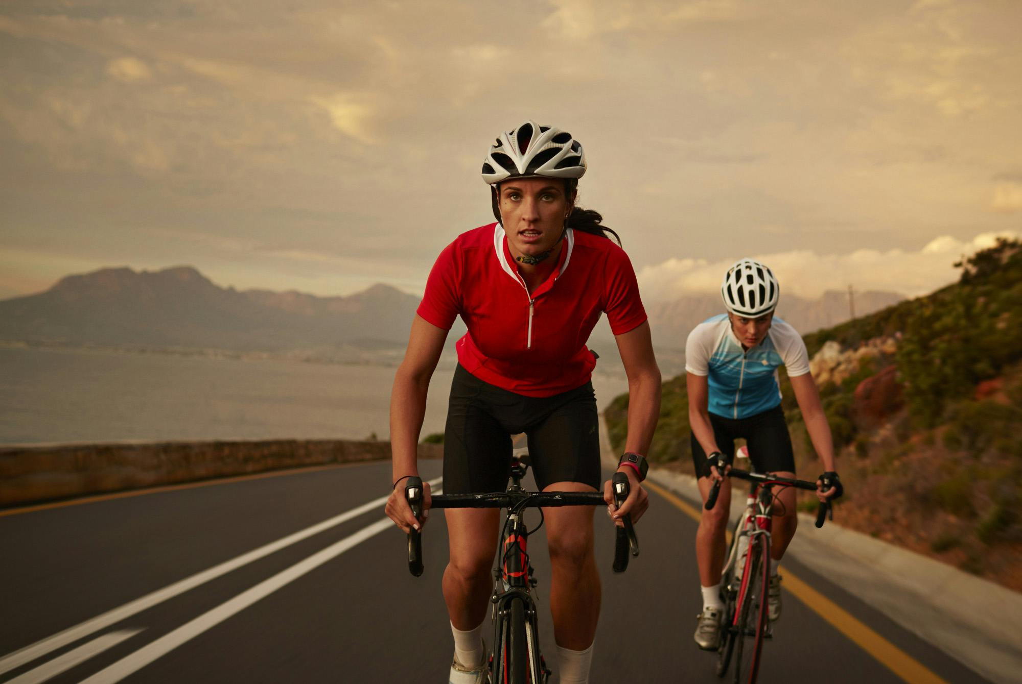 Bike rider accelerating from training partner