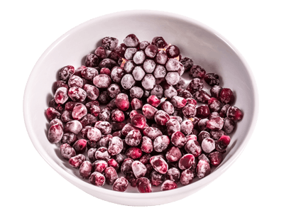 En skål med fryste granateplekjerner