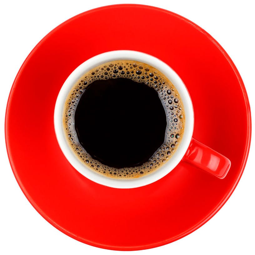 Kahvikuppi ja punainen lautanen.