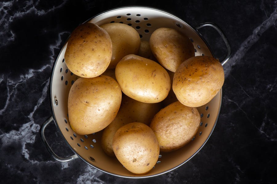 Kokte poteter i dørslag
