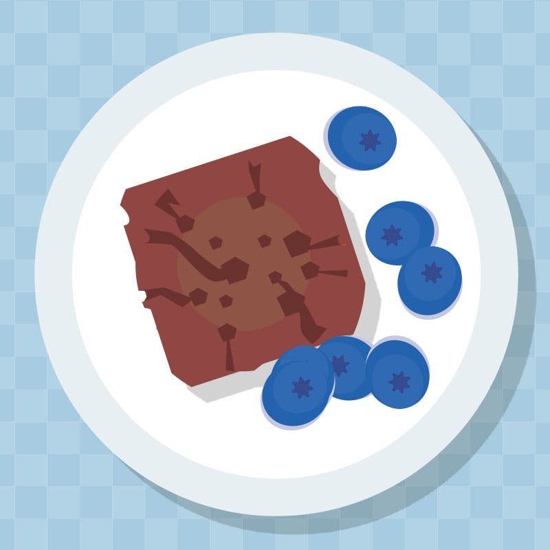 Grafik, brownie og blåbær på lille tallerken