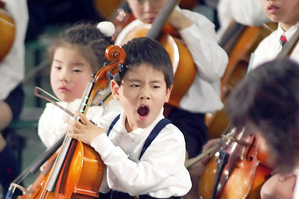 Kid yawning at concert