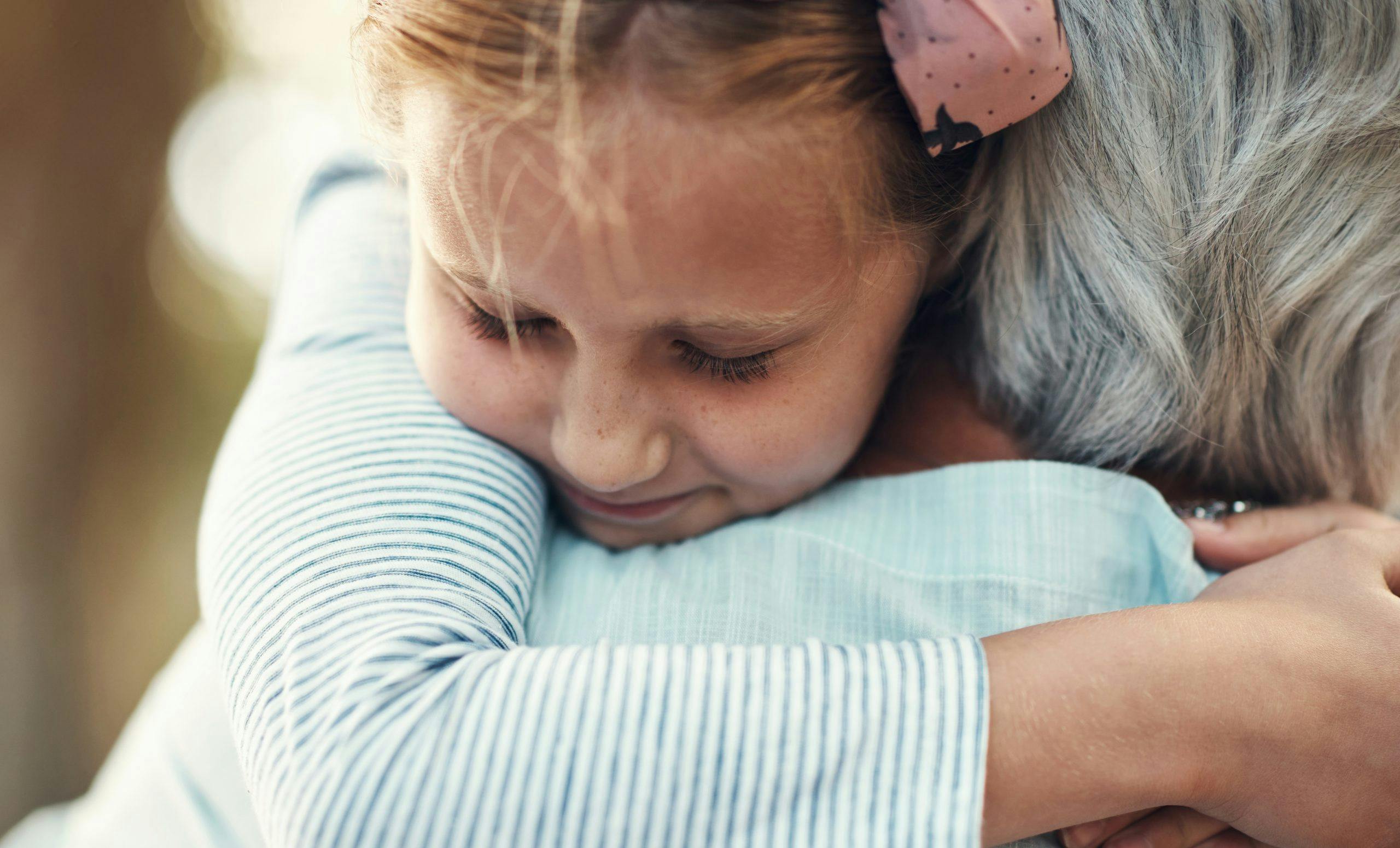Girl, child and hug grandmother